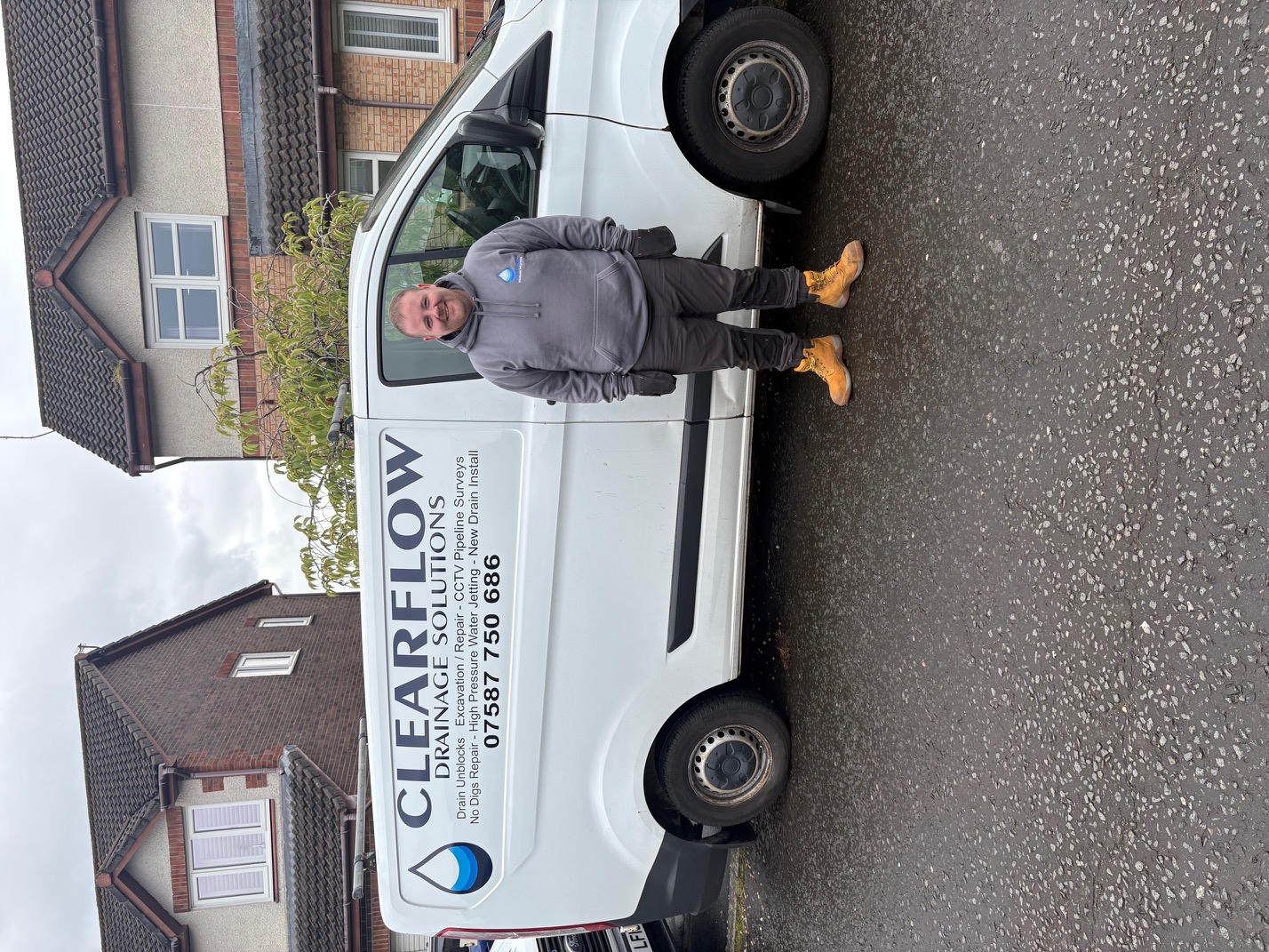 Chris standing beside the ClearFlow van before a drainage job