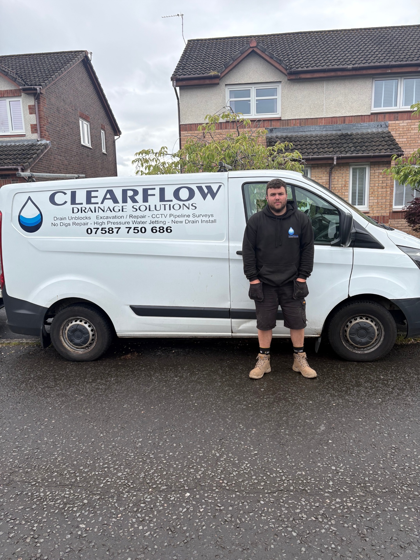 Chris standing beside a ClearFlow van in Glasgow